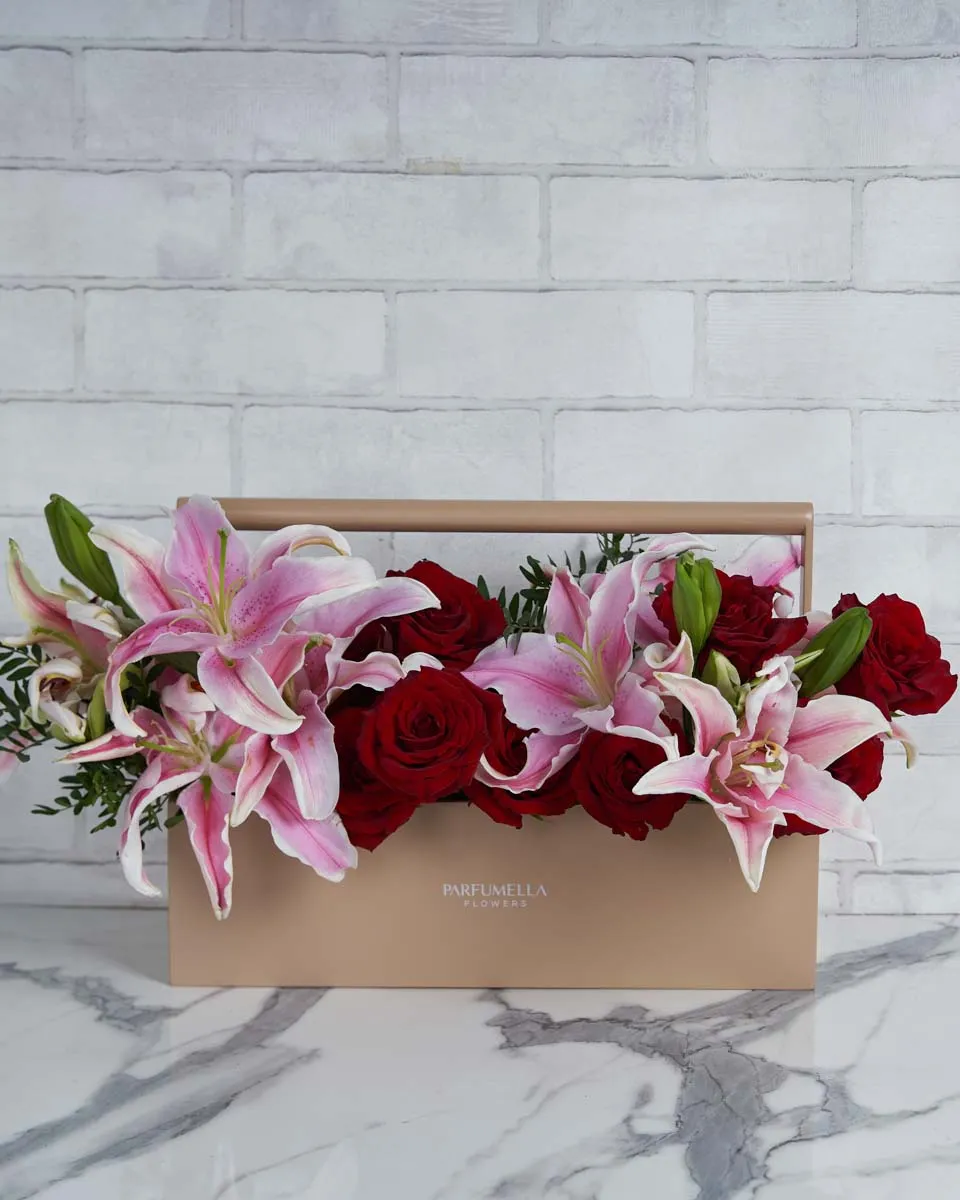 As Lovely As You   Toolbox Combination of Pink Lily and rose red with touch of pistacia 4 lilys  12 red rose .5 pistacia